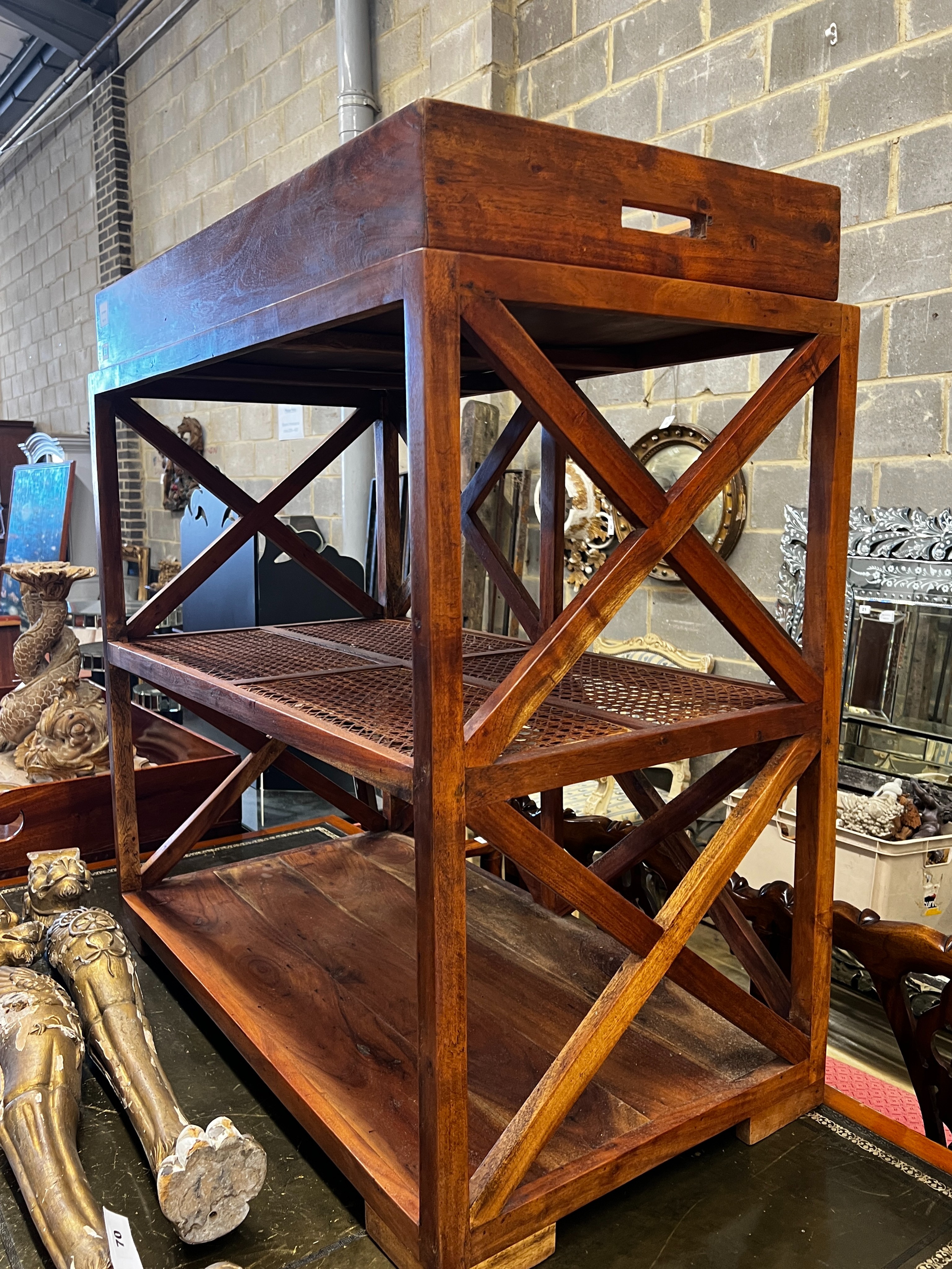 A hardwood and canework tray top three tier table, width 92cm, depth 50cm, height 96cm